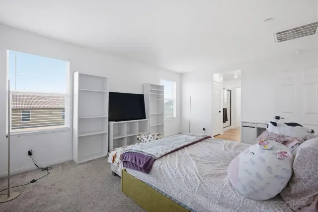 a bathroom with a double vanity sink and mirror