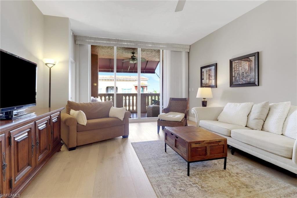 401 Bayfront Place, Unit 3502 Naples, FL 34102 - Photo 2 of 22 Living area featuring ceiling fan and light wood finished floors