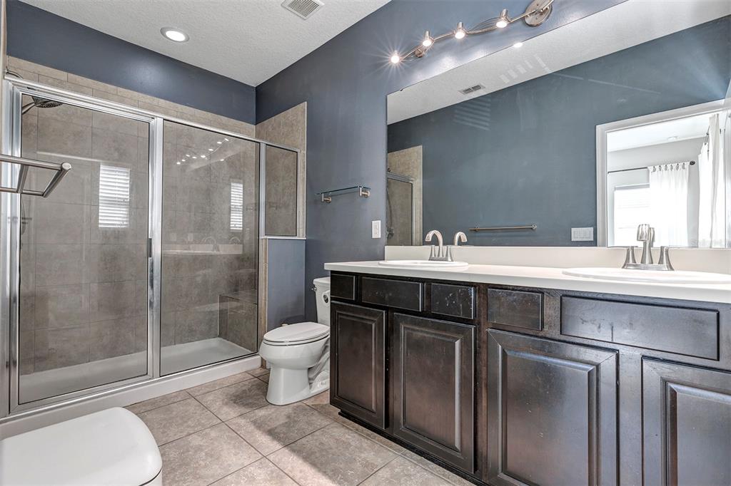 7644 Ripplepointe Way Windermere, FL 34786 - Photo 26 of 52 a bathroom with a sink a toilet and shower