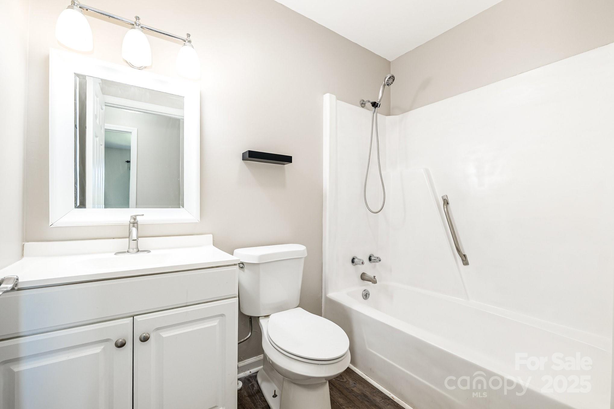 152 Sparrow Road Statesville, NC 28625 - Photo 16 of 28 a bathroom with a sink toilet and shower