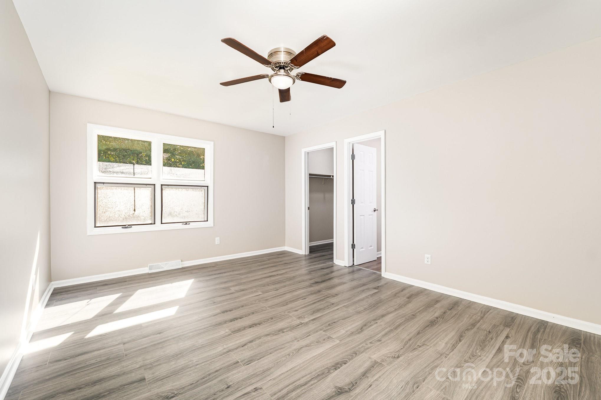 152 Sparrow Road Statesville, NC 28625 - Photo 20 of 28 wooden floor in an empty room with a window