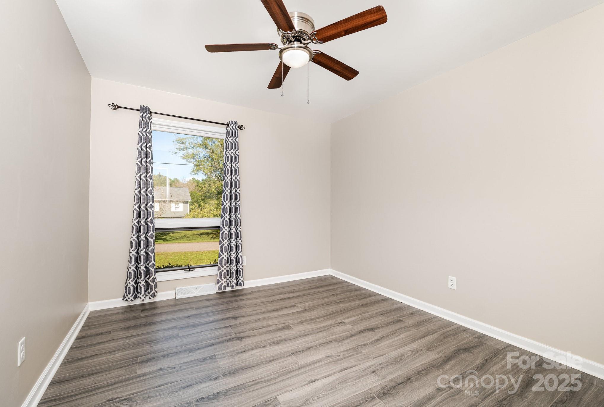 152 Sparrow Road Statesville, NC 28625 - Photo 22 of 28 a view of empty room with wooden floor