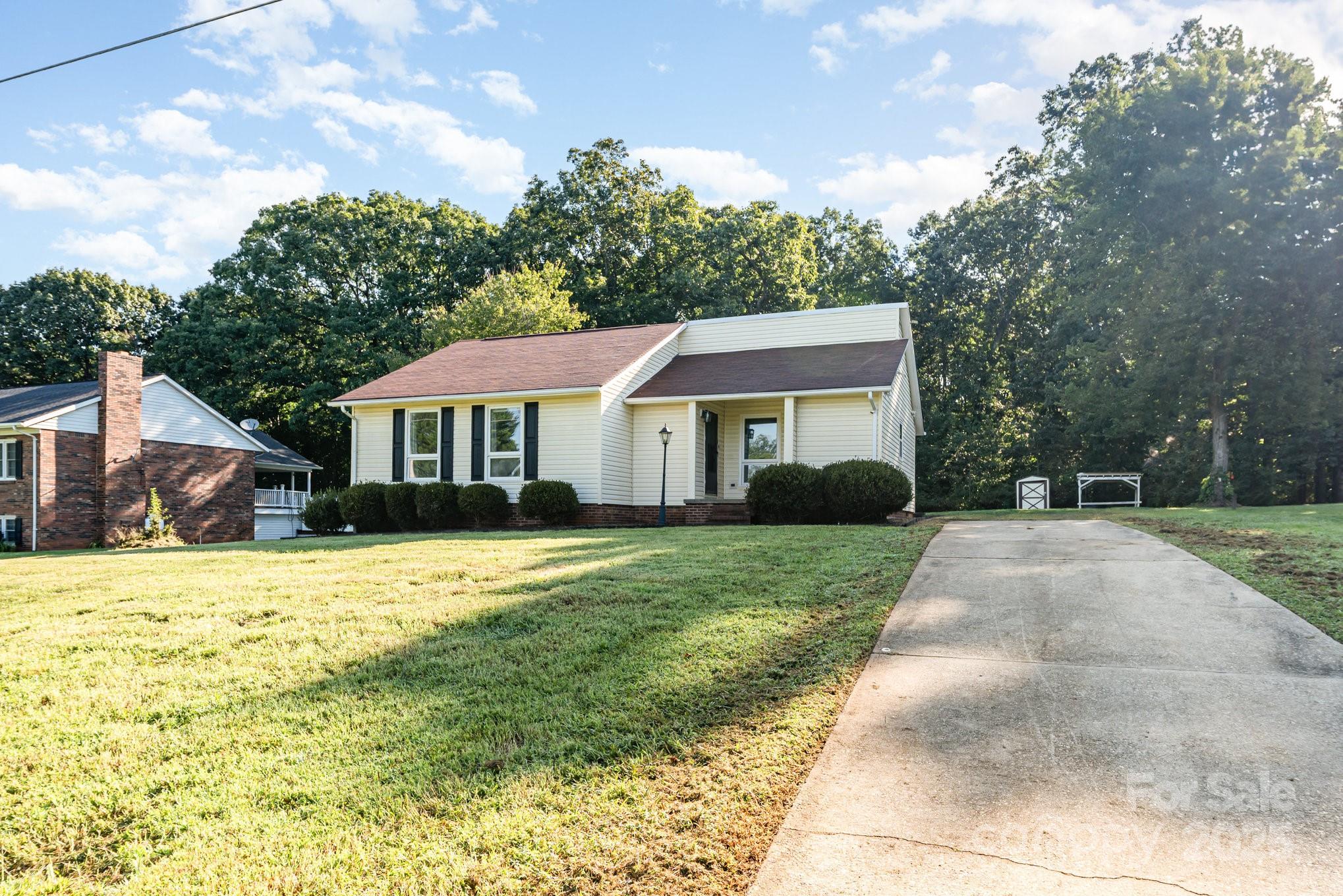 152 Sparrow Road Statesville, NC 28625 - Photo 23 of 28 a front view of a house with a yard