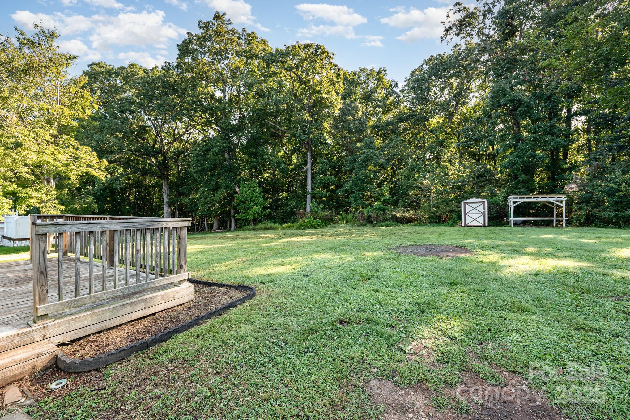 152 Sparrow Road Statesville, NC 28625 - Photo 27 of 28 a view of a chair and table on the green field