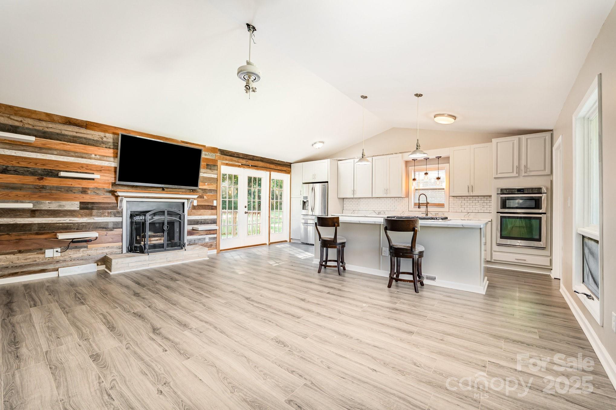 152 Sparrow Road Statesville, NC 28625 - Photo 5 of 28 a view of kitchen with microwave stove refrigerator and cabinets