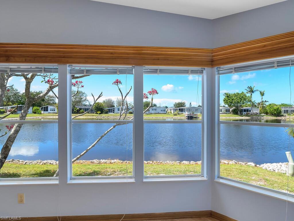 269 Riverwood Road Naples, FL 34114 - Photo 12 of 32 a view of swimming pool from a window