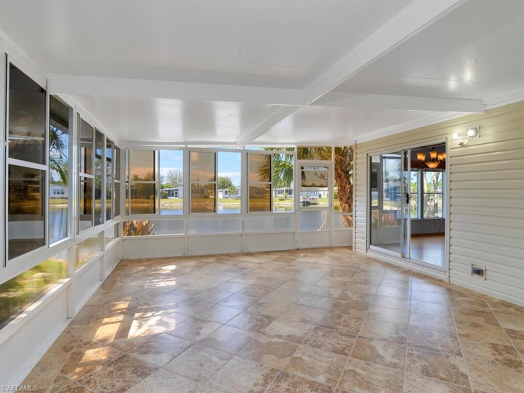 269 Riverwood Road Naples, FL 34114 - Photo 14 of 32 a view of an entryway with floor to ceiling windows and dining room