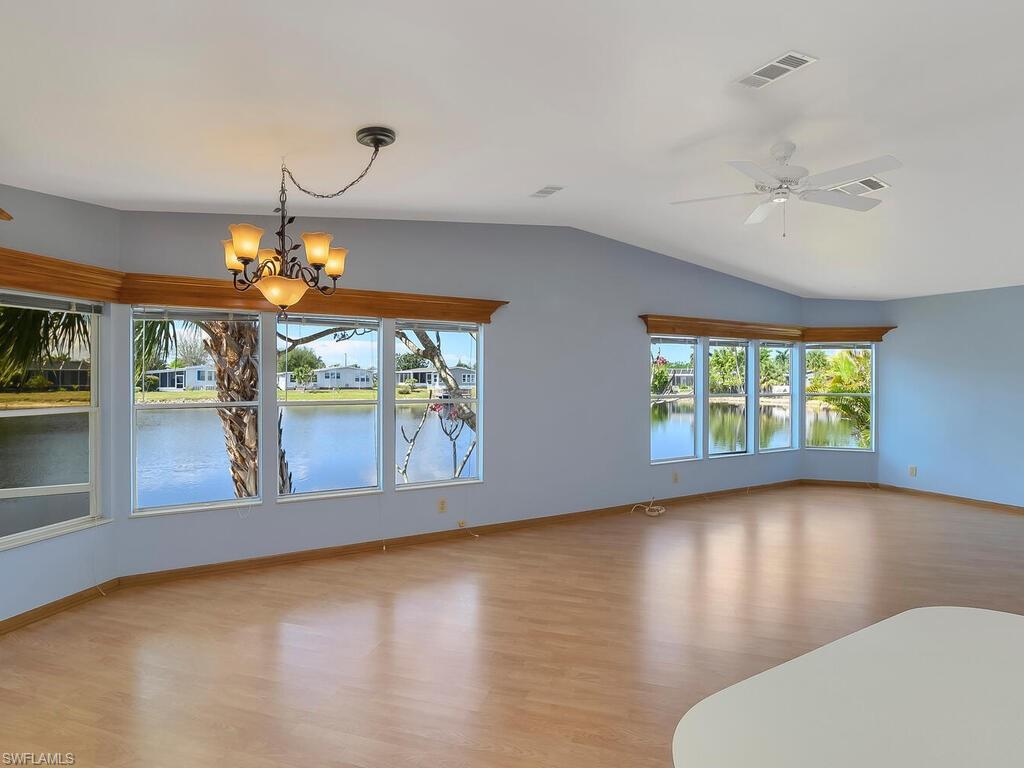269 Riverwood Road Naples, FL 34114 - Photo 10 of 32 a view of a livingroom with furniture window and wooden floor