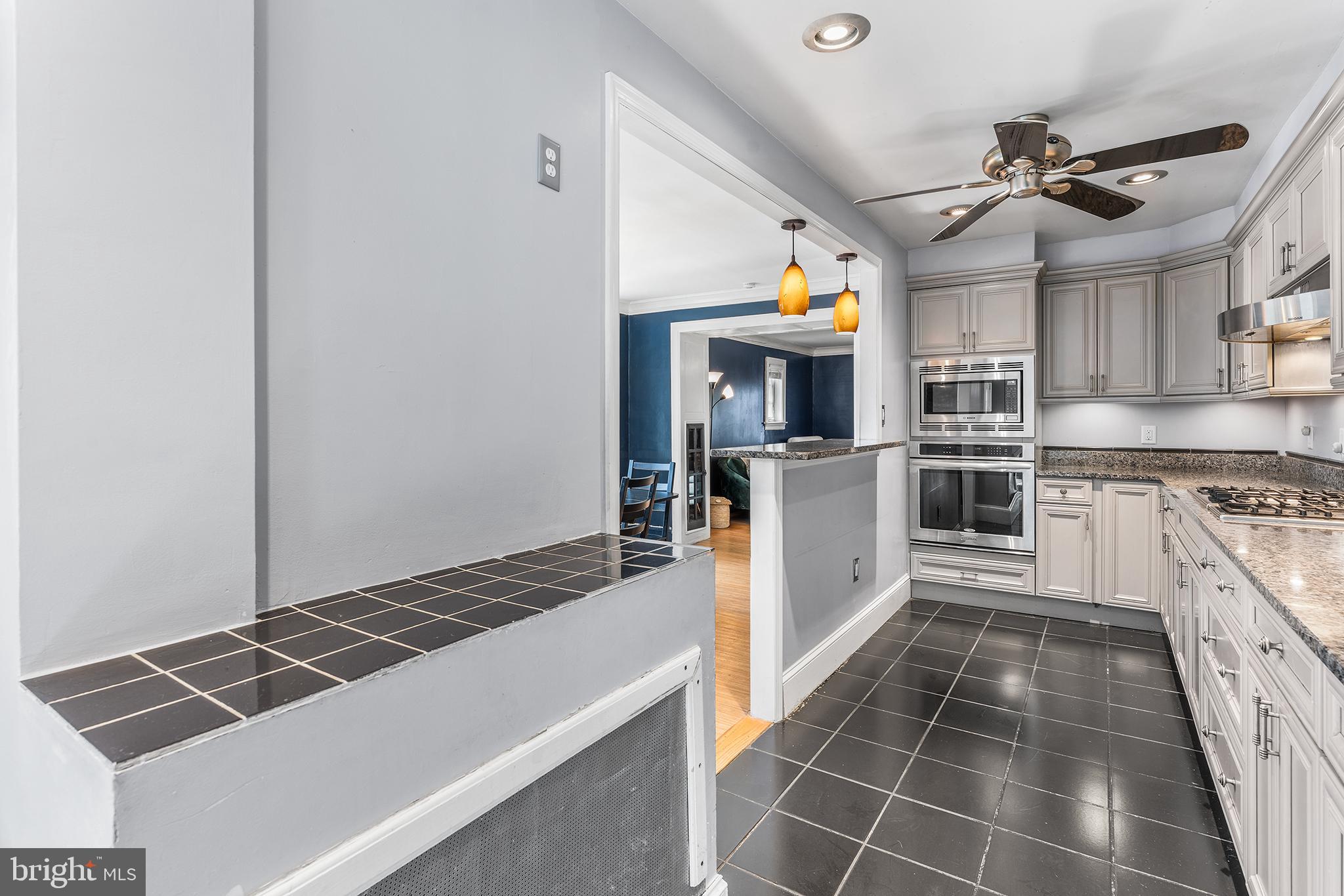 295 Braddock Avenue Lansdowne, PA 19050 - Photo 15 of 36 a kitchen with a stove and a microwave