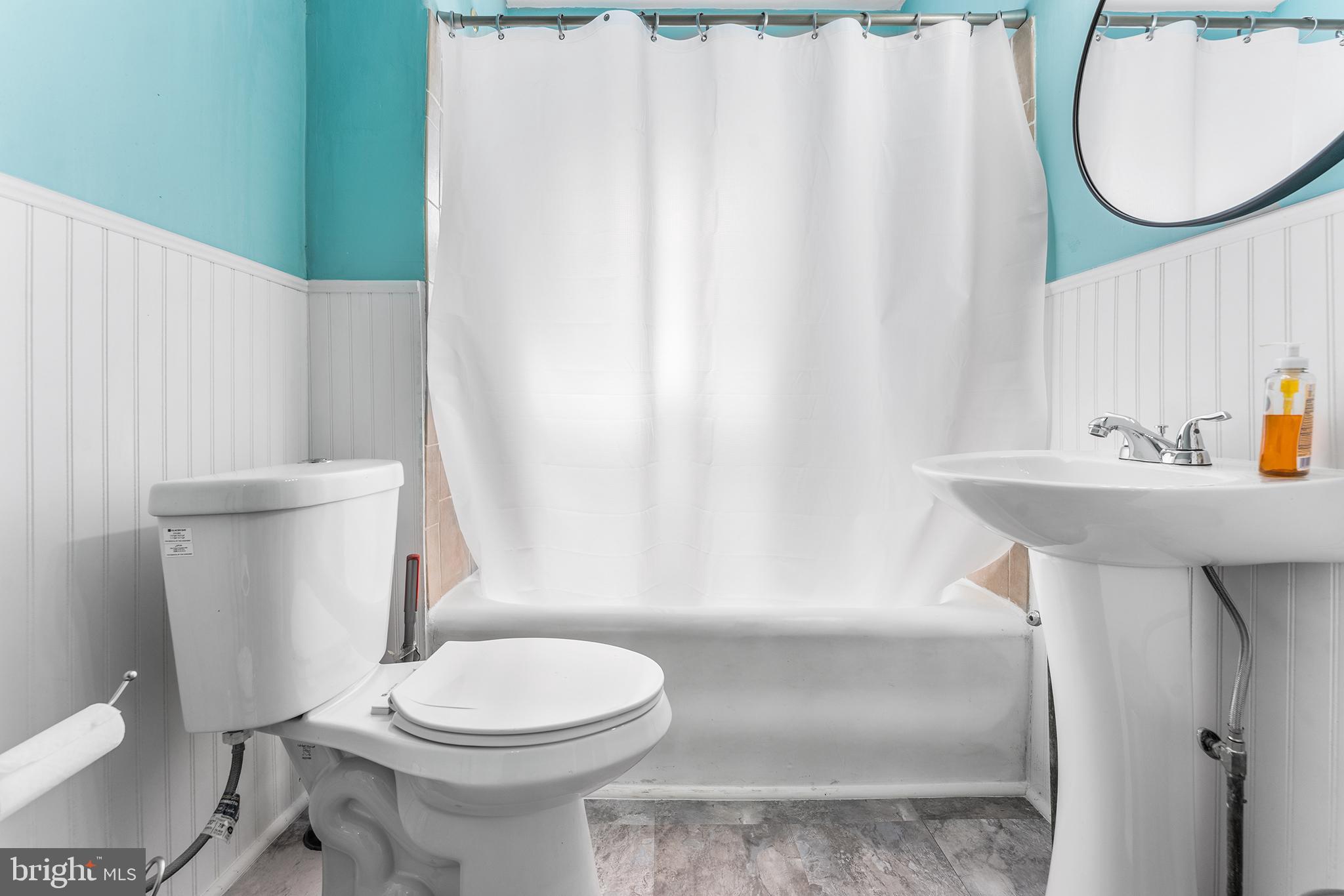 295 Braddock Avenue Lansdowne, PA 19050 - Photo 25 of 36 a bathroom with a sink toilet and mirror