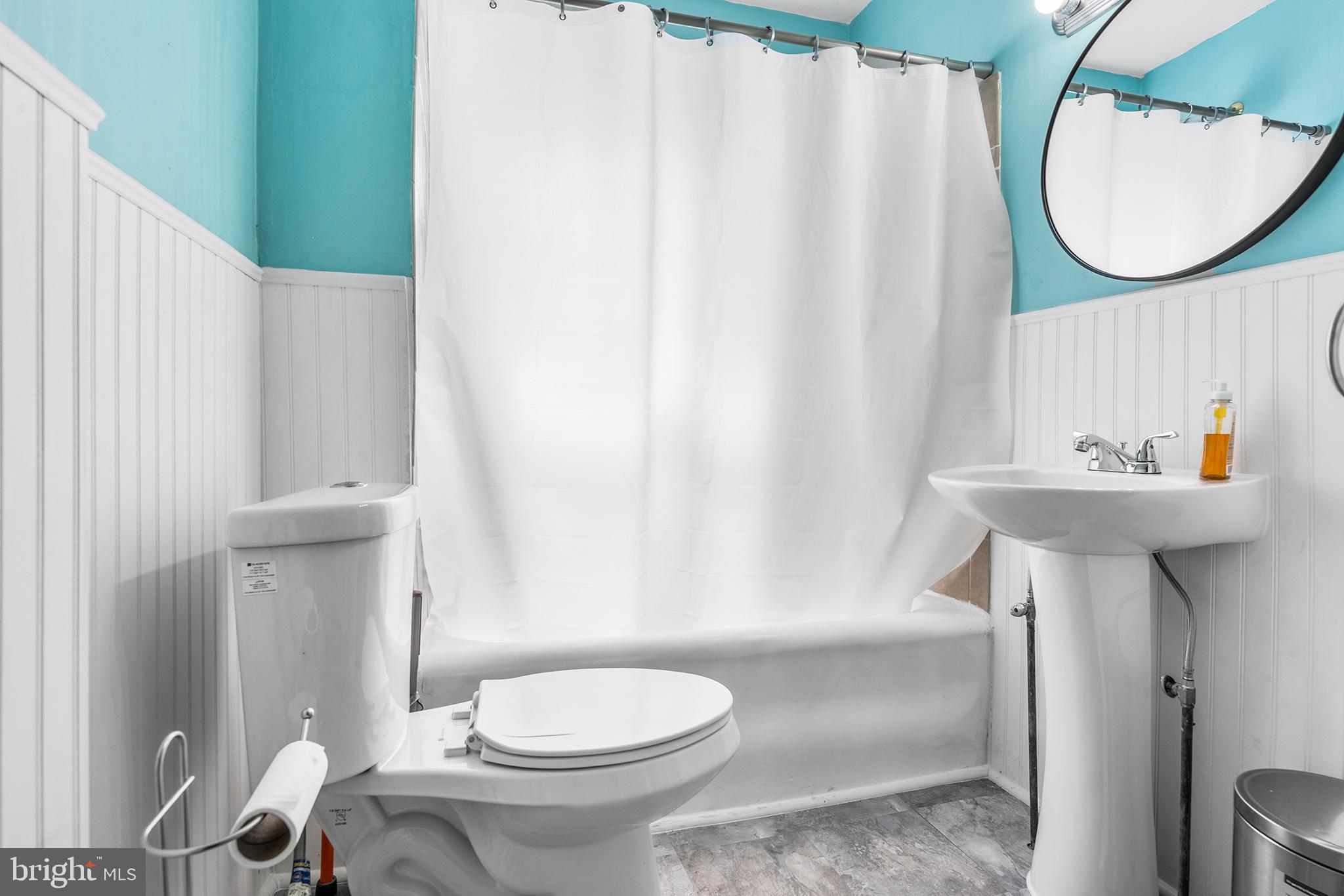 295 Braddock Avenue Lansdowne, PA 19050 - Photo 26 of 36 a bathroom with a sink toilet and mirror