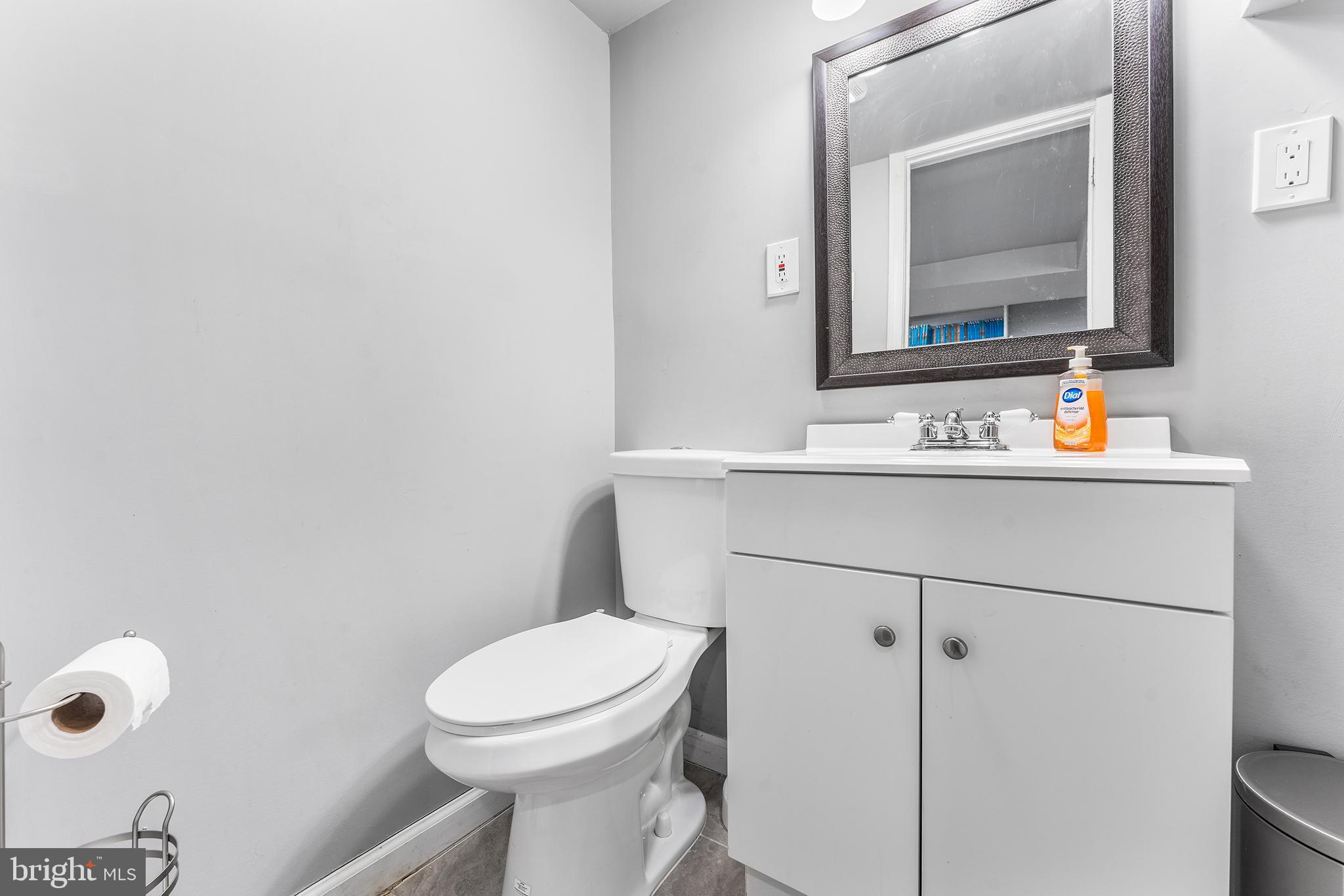 295 Braddock Avenue Lansdowne, PA 19050 - Photo 28 of 36 a bathroom with a toilet sink and mirror