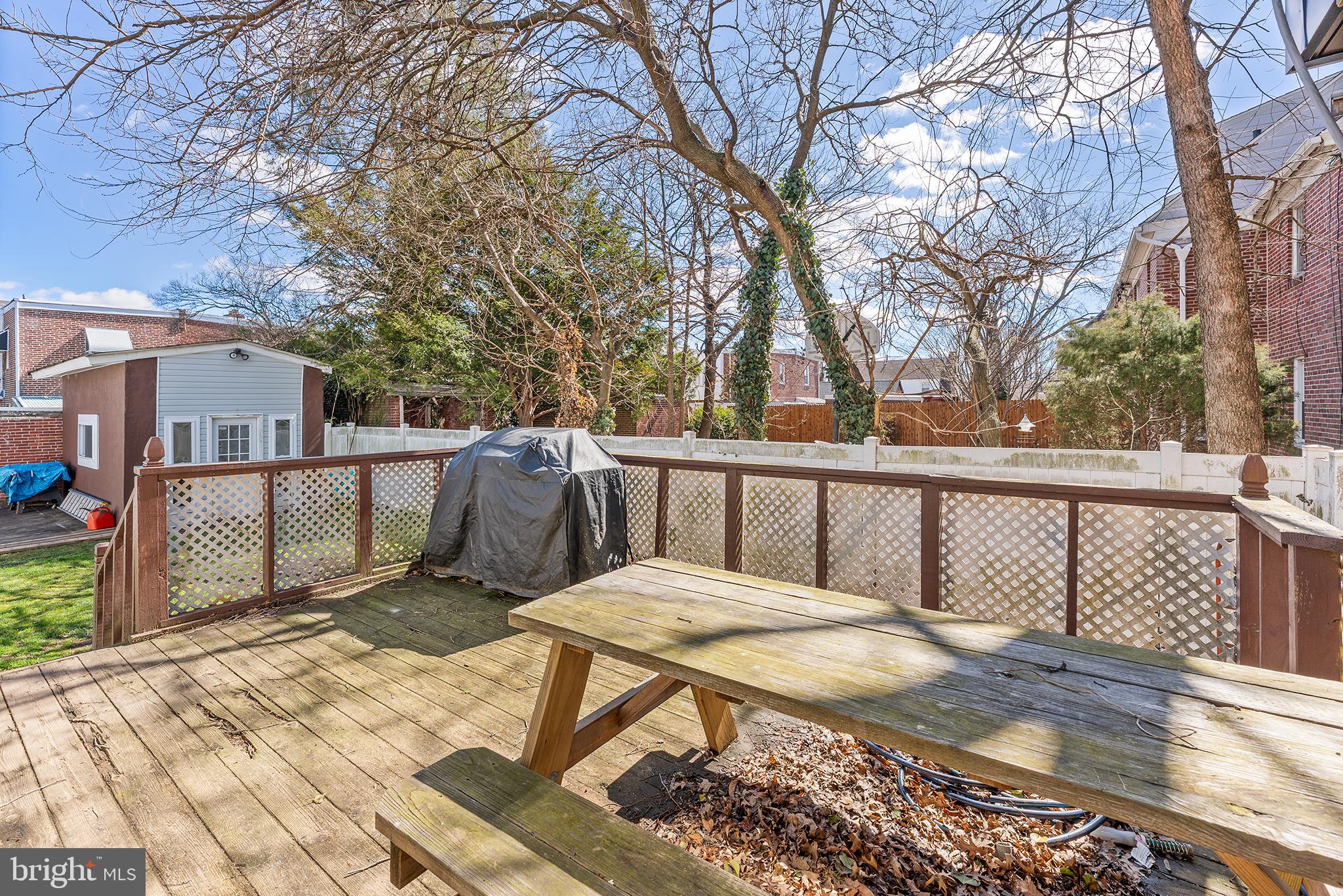 295 Braddock Avenue Lansdowne, PA 19050 - Photo 30 of 36 a view of a balcony with wooden floor and fence