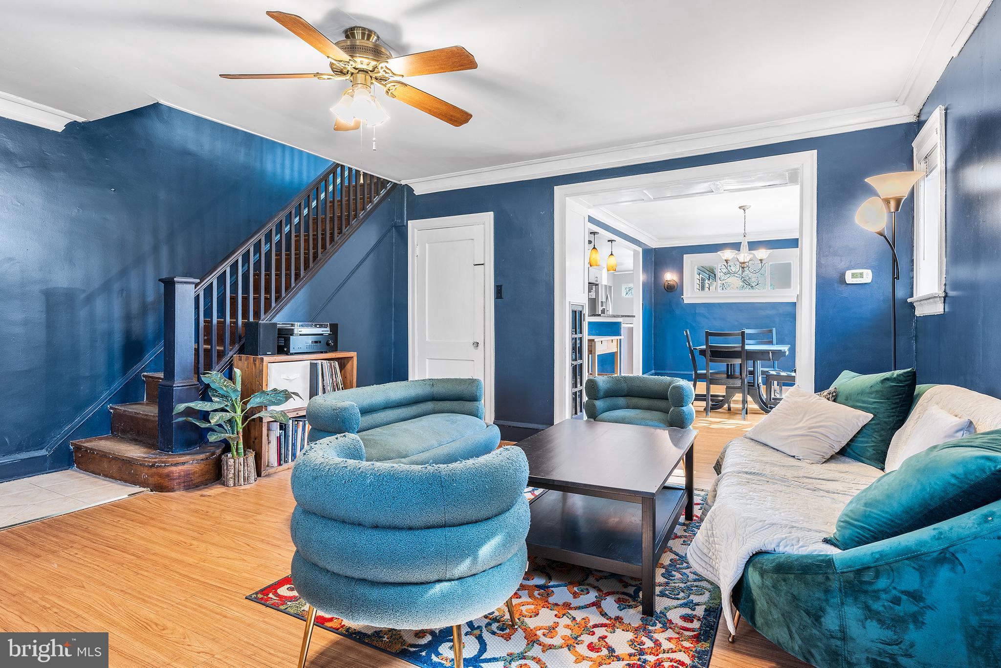 295 Braddock Avenue Lansdowne, PA 19050 - Photo 5 of 36 a living room with furniture and a chandelier