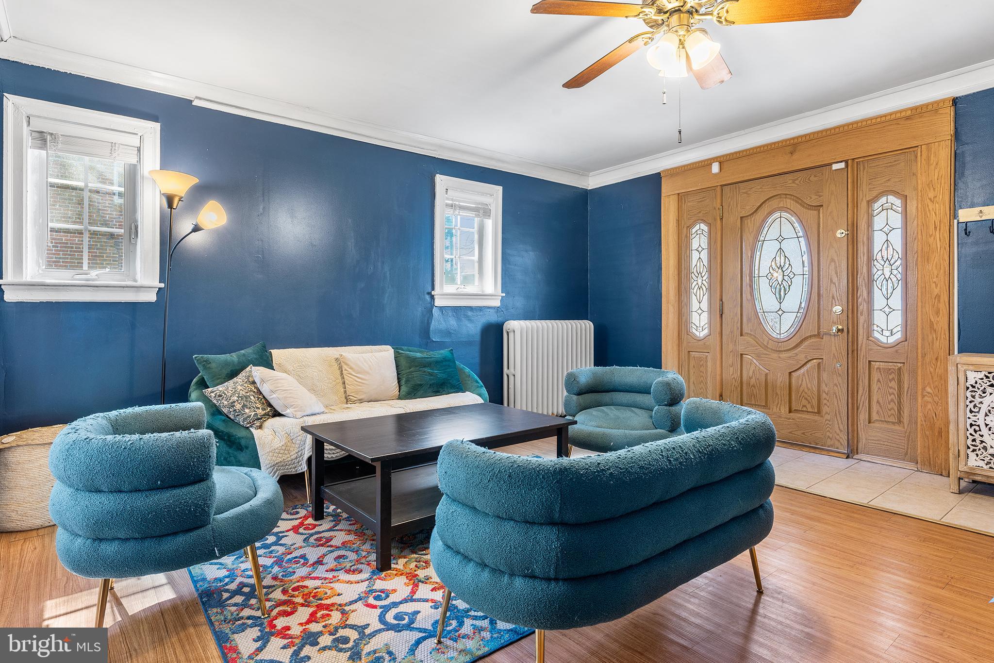 295 Braddock Avenue Lansdowne, PA 19050 - Photo 6 of 36 a living room with furniture and a large window