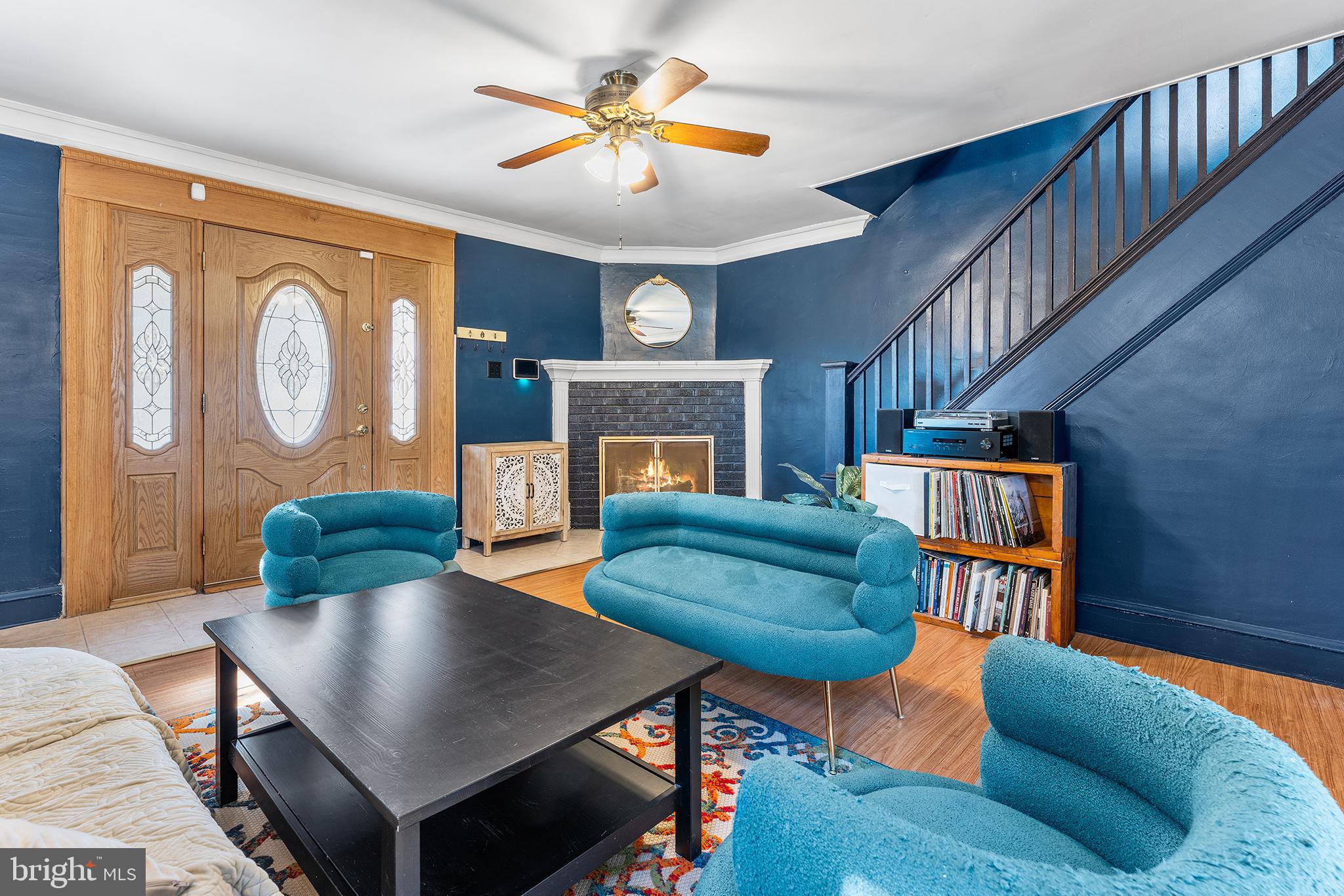295 Braddock Avenue Lansdowne, PA 19050 - Photo 7 of 36 a living room with furniture and a fireplace