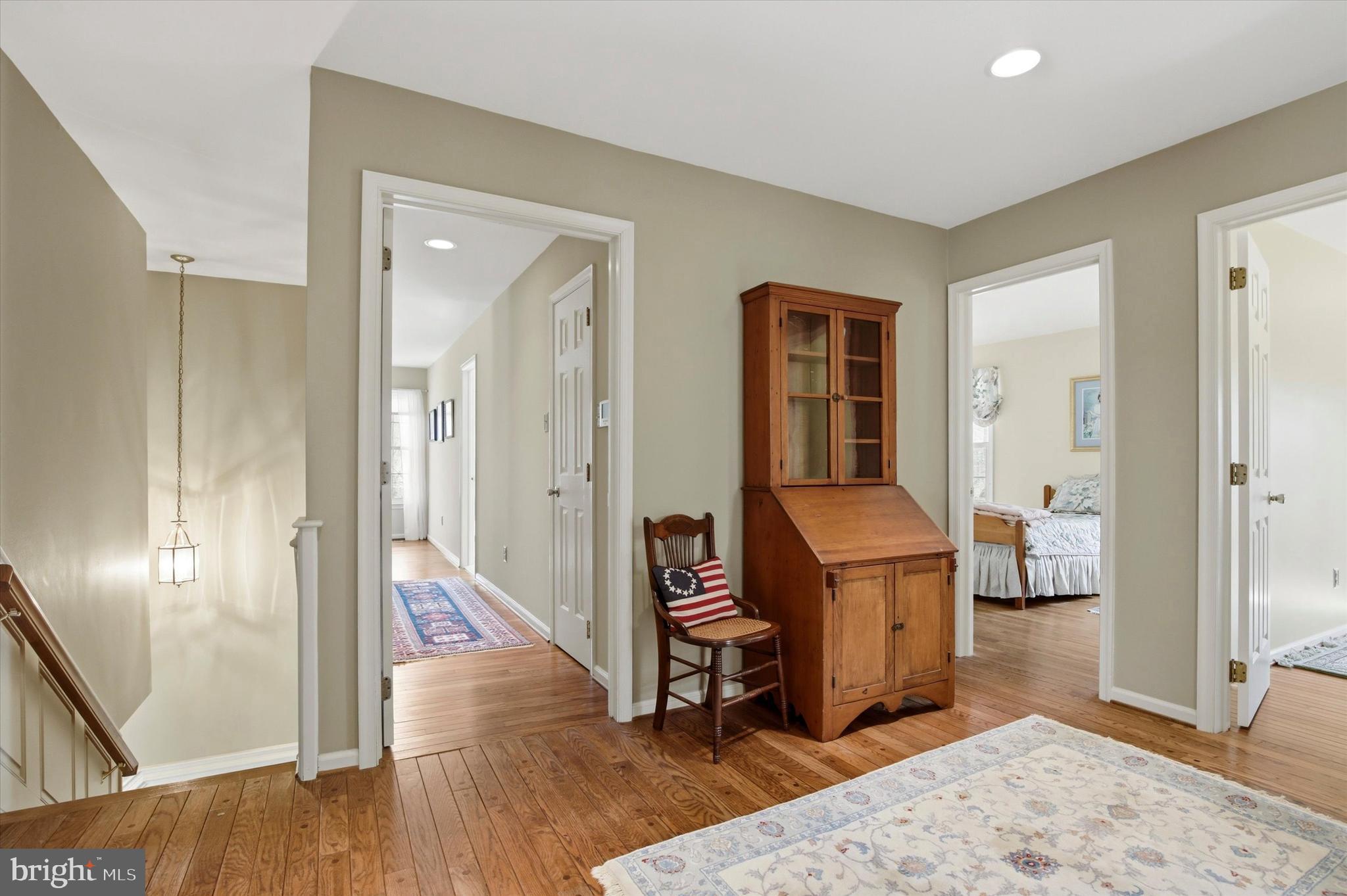 1307 Jaine Lane Spring City, PA 19475 - Photo 20 of 47 a view of a hallway with bathroom and wooden floor