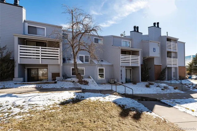 a view of a house with a snow in the yard