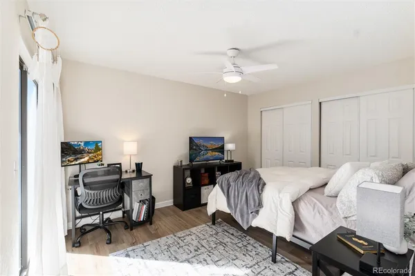 a bedroom with a bed and a chair