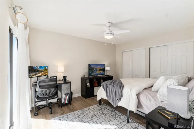 a bedroom with a bed and a chair