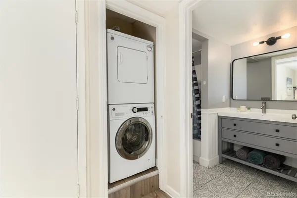 a view of a bathroom with a sink and a mirror