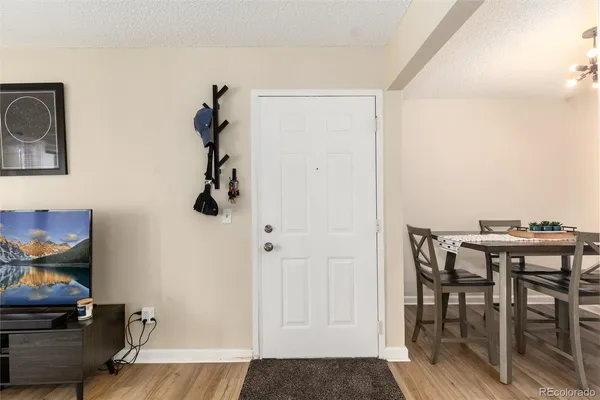 a view of a livingroom with furniture and wooden floor