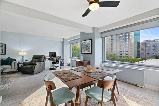 a view of a dining room with furniture window and outside view