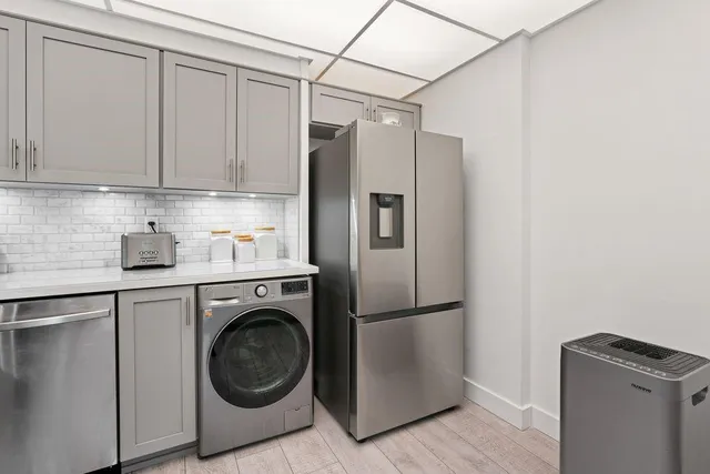a utility room with dryer and washer