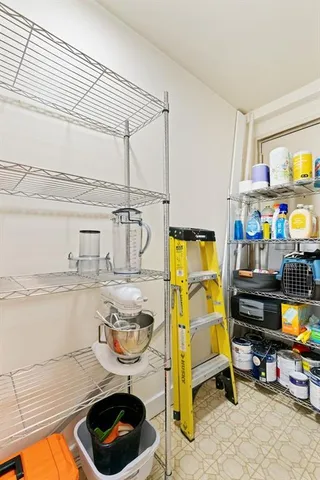 a kitchen with a sink and a stove next to a window