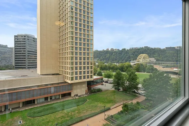 a view of a balcony with yard