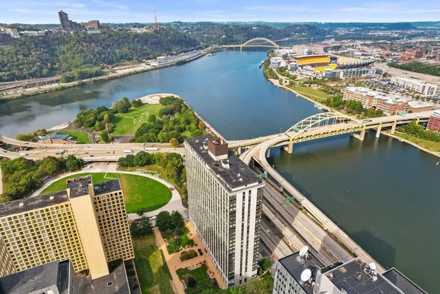an aerial view of a house with a lake view