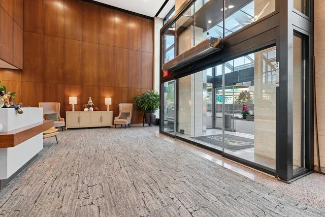 a view of a living room and a balcony