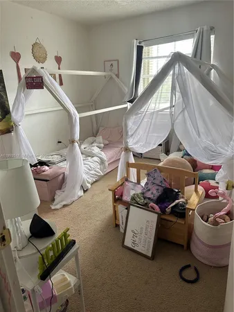 a room with lots of furniture and air hockey table