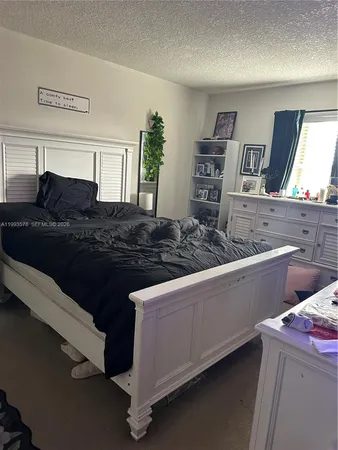a kitchen with a sink and wooden cabinets