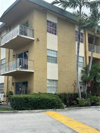 a front view of a house with lots of green space