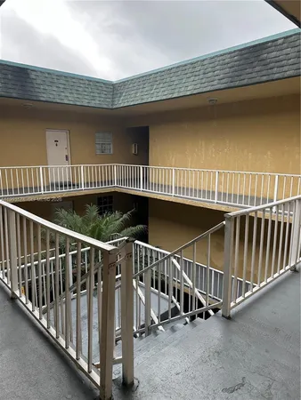 a view of balcony with furniture and wooden floor