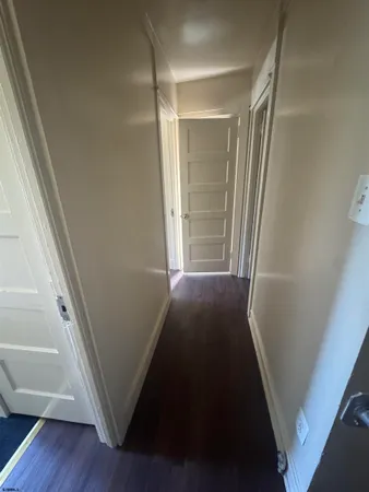 a view of front door with wooden floor