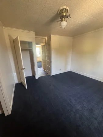 a view of a livingroom with a staircase