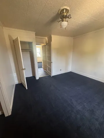 a view of a livingroom with a staircase