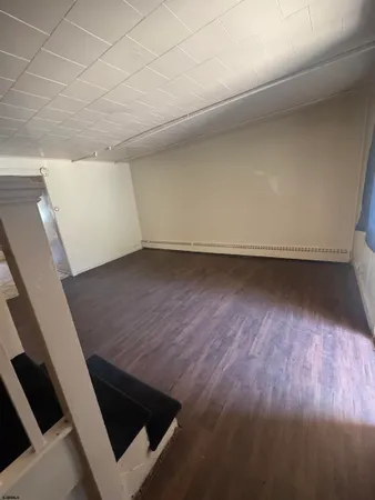 a view of wooden floor in an empty room