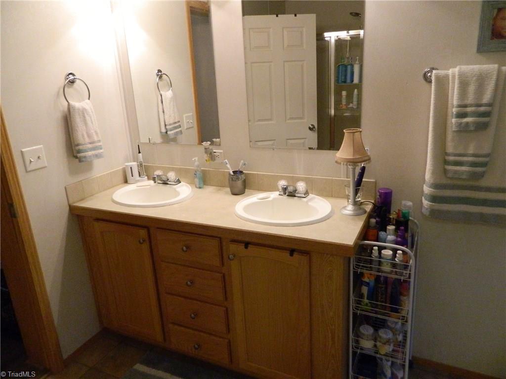 3180 Jess Smith Road Sophia, NC 27350 - Photo 14 of 17 Double vanity in master bathroom