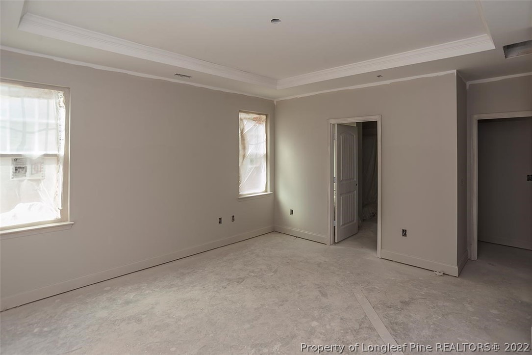 185 Sandy Springs Road Aberdeen, NC 28315 - Photo 10 of 21 an empty room with windows and closet