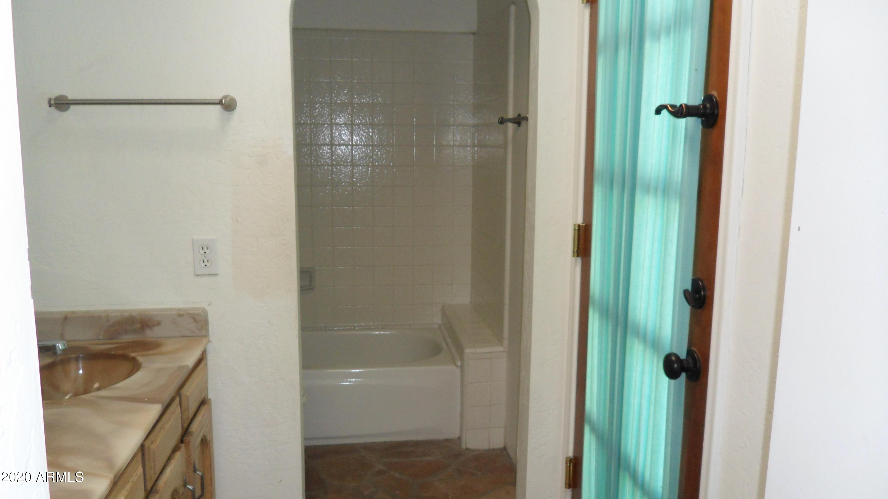6935 East Hearn Road Scottsdale, AZ 85254 - Photo 15 of 19 HALL BATH EXIT TO PATIO