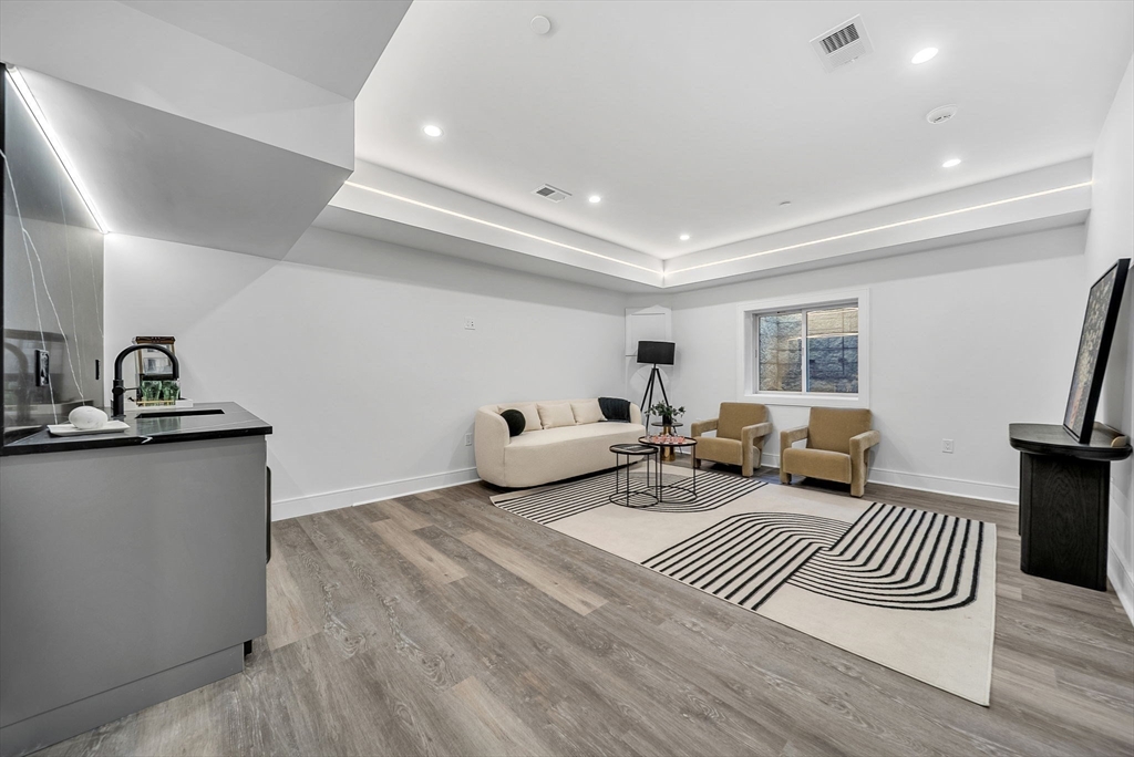 282 Nevada Street, Unit 282 Newton, MA 02460 - Photo 20 of 30 a living room with furniture