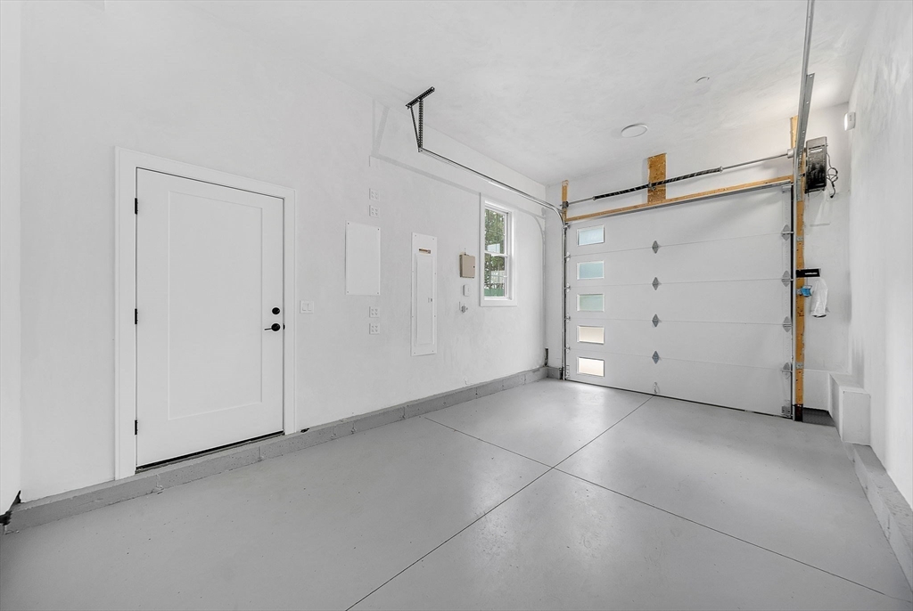 282 Nevada Street, Unit 282 Newton, MA 02460 - Photo 22 of 30 a view of a big room with closet and cabinet