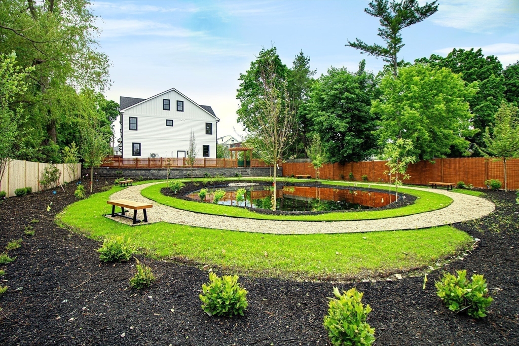 282 Nevada Street, Unit 282 Newton, MA 02460 - Photo 26 of 30 a view of a swimming pool with a yard
