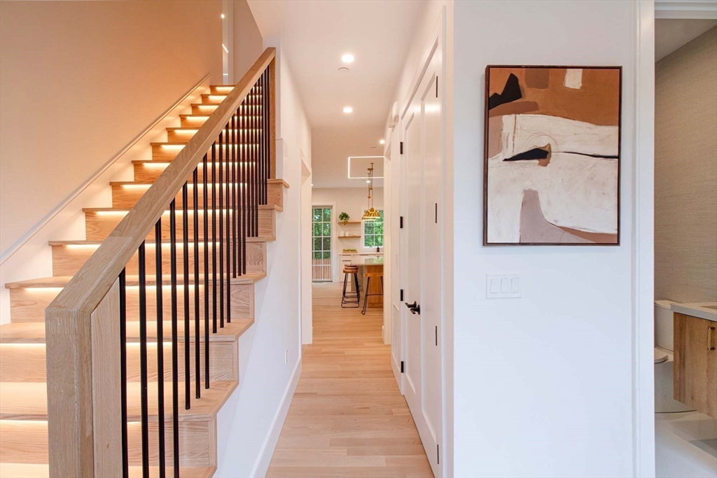282 Nevada Street, Unit 282 Newton, MA 02460 - Photo 5 of 30 a view of a hallway with wooden floor