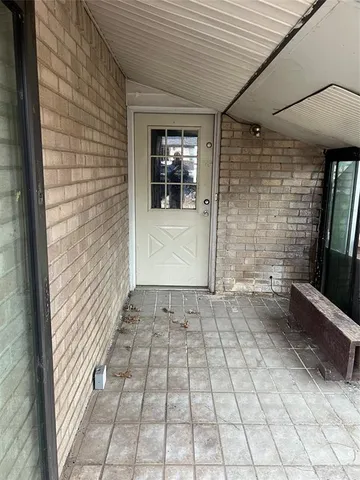 a view of hallway with stairs and wooden floor
