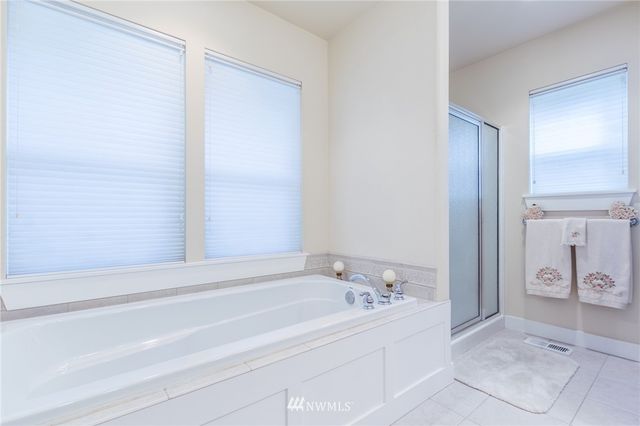 a bathroom with a bathtub and a sink