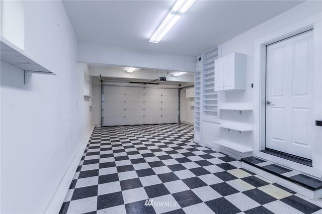 a room with a black white checkered floor and a black white checkered floor